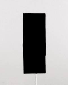 Black 4.0 paint displayed on a vertical surface, showcasing its deep, matte black finish against a light background.