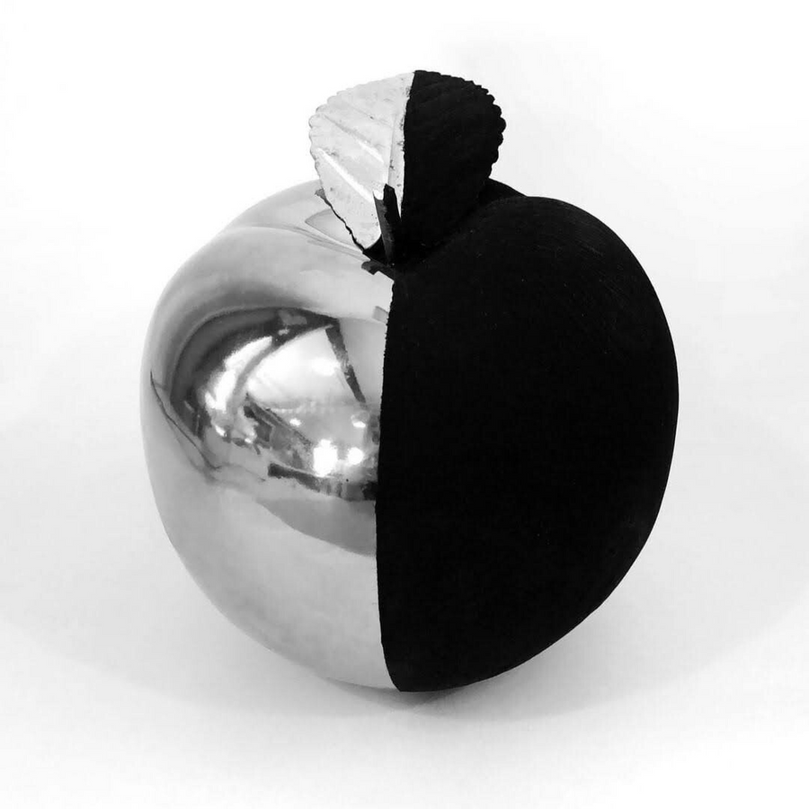 A chrome apple with one half painted in Black 4.0, the painted half gone completely flat
