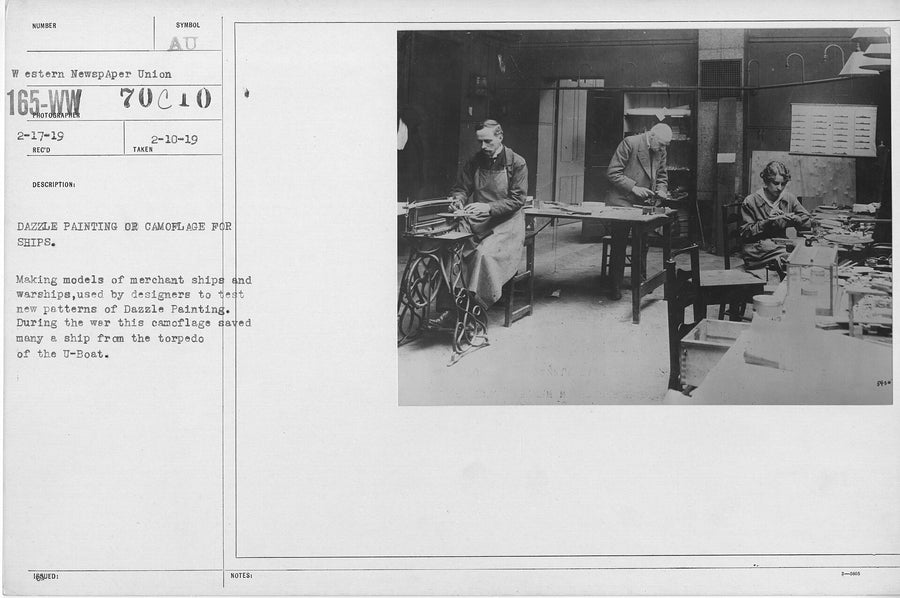 Workers making and painting model ships to test dazzle camouflage patterns